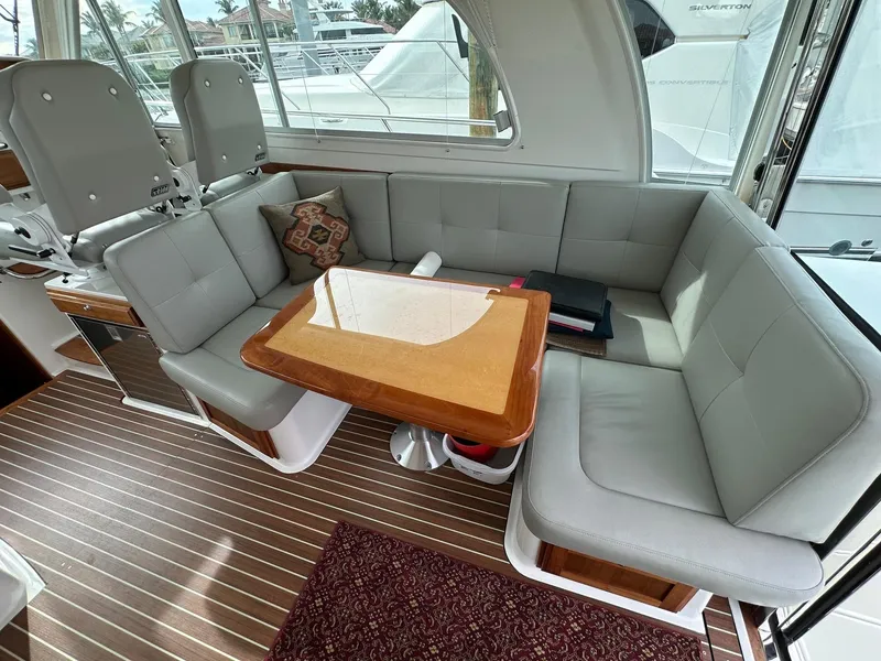 Slide: The Image of Luxurious 2020 Back Cove 41 yacht interior with elegant seating and wooden table. - 6