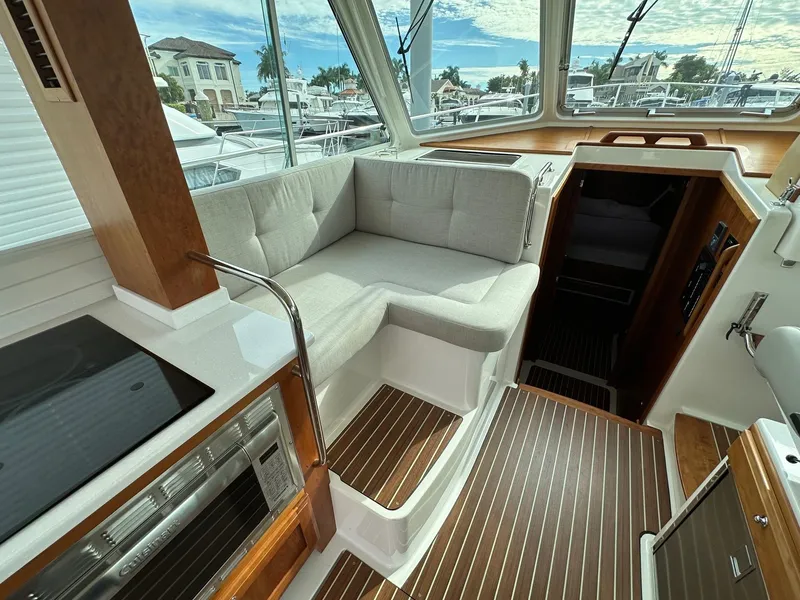 Slide: The Image of Interior of 2020 Back Cove 41 yacht with modern seating and wooden flooring. - 7