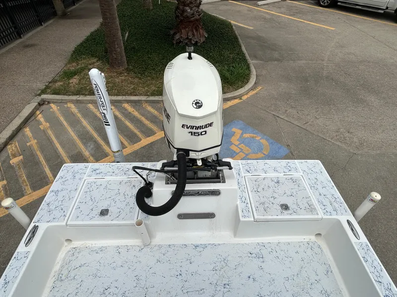 Slide: The Image of 2012 Shallow Sport 21 Sport boat with Evinrude 150 engine in parking lot. - 6