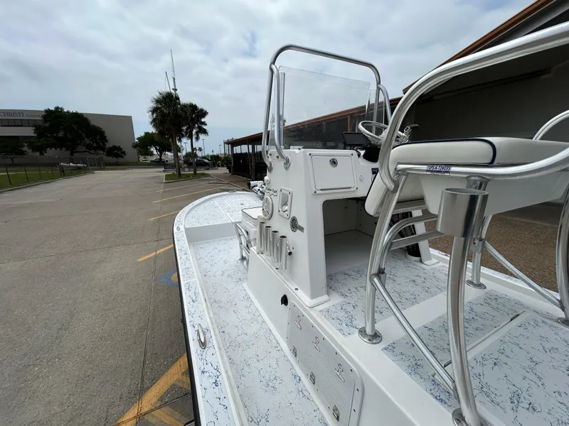 Slide: The Image of 2012 Shallow Sport 21 Sport boat with center console in a parking lot. - 9