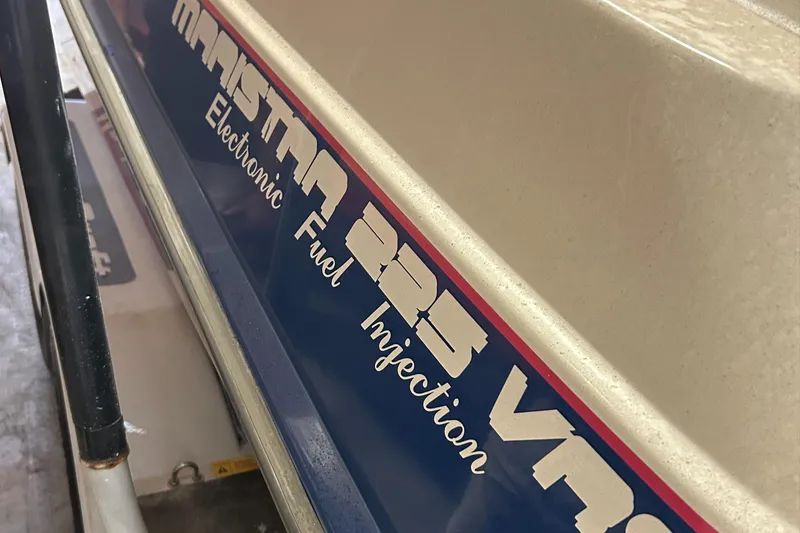 Slide: The Image of 1994 MasterCraft MARISTAR 225 VRS boat with electronic fuel injection branding. - 3