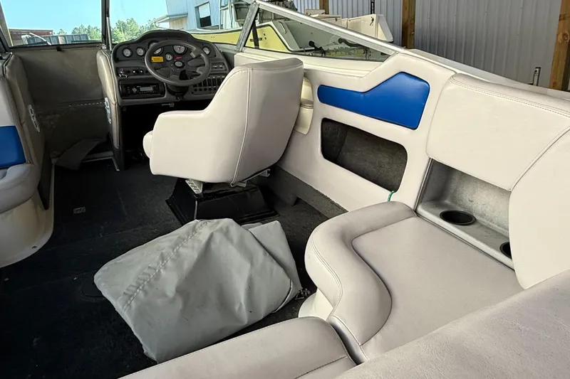 Slide: The Image of 1994 MasterCraft MARISTAR 225 VRS boat interior with white and blue seating. - 4