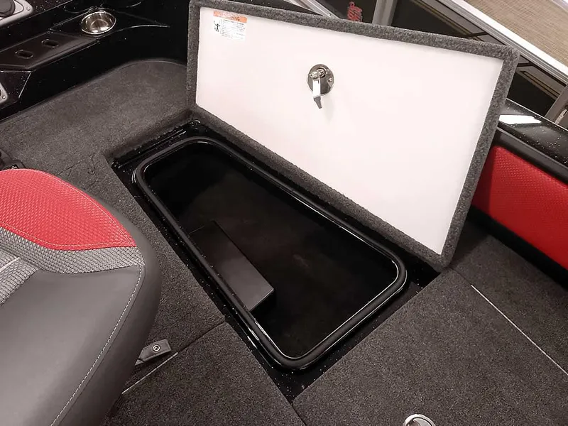 Slide: The Image of 2024 Ranger 2080MS Angler boat storage compartment with open lid and red seat detail. - 13