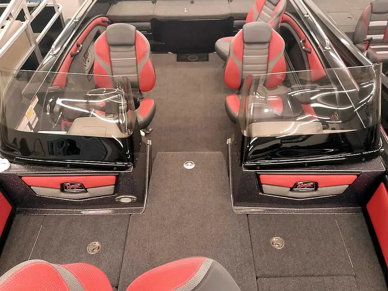 Slide: The Image of 2024 Ranger 2080MS Angler boat interior with red and gray seating and dual consoles. - 19