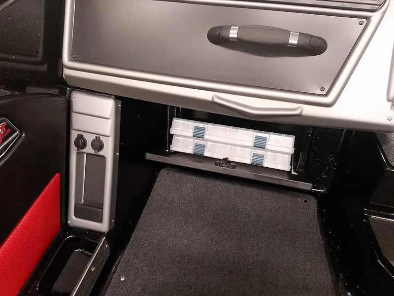 Slide: The Image of 2024 Ranger 2080MS Angler boat interior storage compartment with organized tackle boxes. - 23