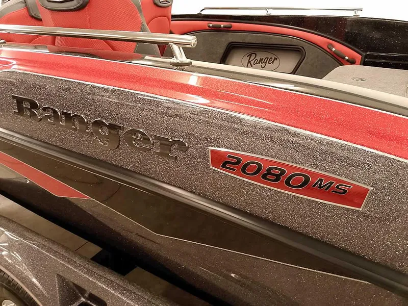 Slide: The Image of 2024 Ranger 2080MS Angler boat with red and black detailing. - 3