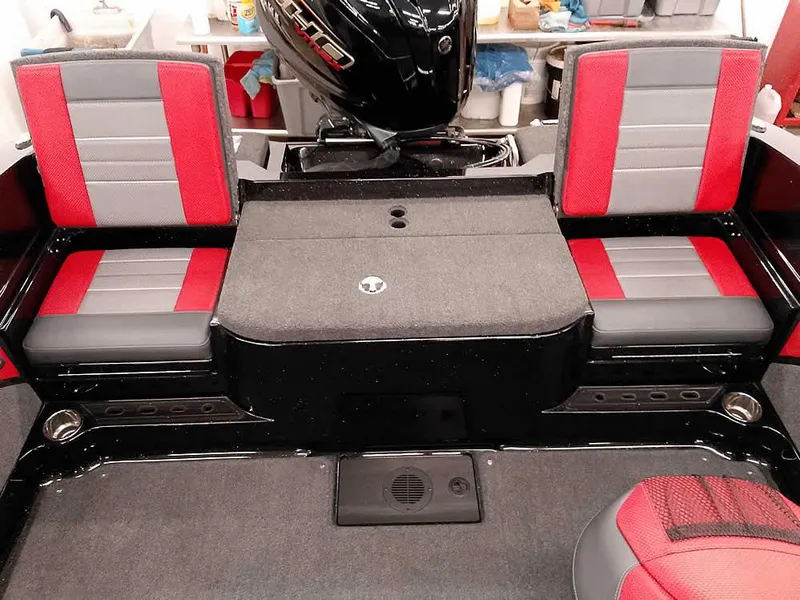 Slide: The Image of 2024 Ranger 2080MS Angler boat interior with red and gray seating. - 30
