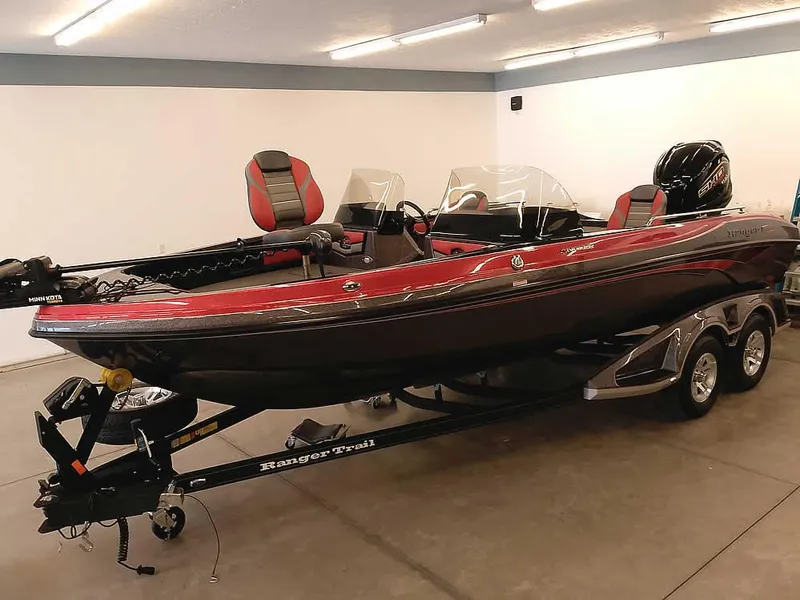 Slide: The Image of 2024 Ranger 2080MS Angler boat in showroom, red and black design, on trailer. - 36