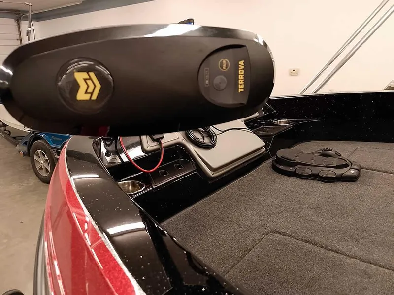 Slide: The Image of 2024 Ranger 2080MS Angler boat with Terrova trolling motor in a garage setting. - 6