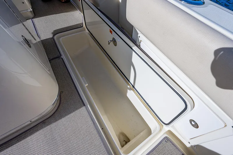 Slide: The Image of Storage compartment on 2019 Chris-Craft Catalina 27 boat, open and empty. - 26