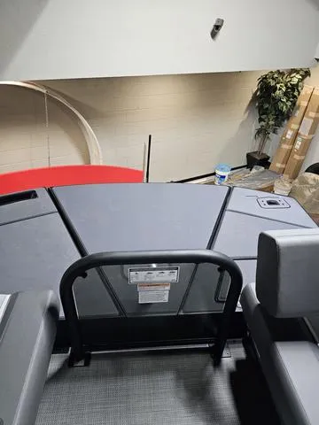 Slide: The Image of 2025 Manitou 20' Cruise Bench Max Deck with 150HP Stealth Motor, interior view. - 14