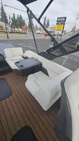 Slide: The Image of 2025 Manitou 24 EXPLORE DUAL MOTOR NAVIGATOR with sleek seating and modern design. - 11