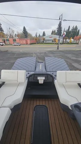 Slide: The Image of 2025 Manitou 24 EXPLORE DUAL MOTOR NAVIGATOR boat with sleek seating and modern design. - 12