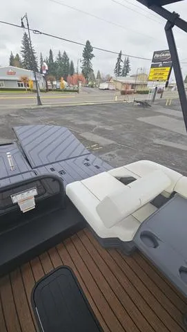 Slide: The Image of 2025 Manitou 24 EXPLORE DUAL MOTOR NAVIGATOR boat with sleek seating and modern design. - 13