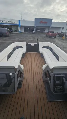 Slide: The Image of 2025 Manitou 24 EXPLORE DUAL MOTOR NAVIGATOR pontoon boat with spacious seating and sleek design. - 7