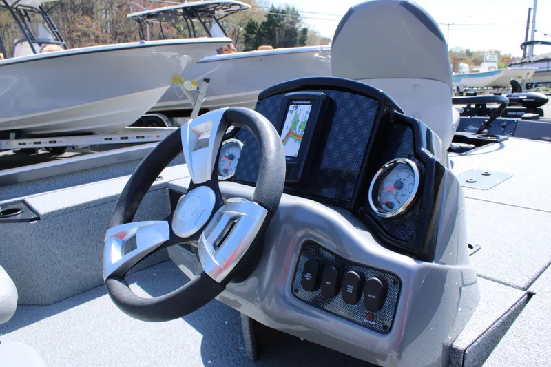 Slide: The Image of 2025 G3 Sportsman 1610 boat dashboard with steering wheel and gauges. - 11