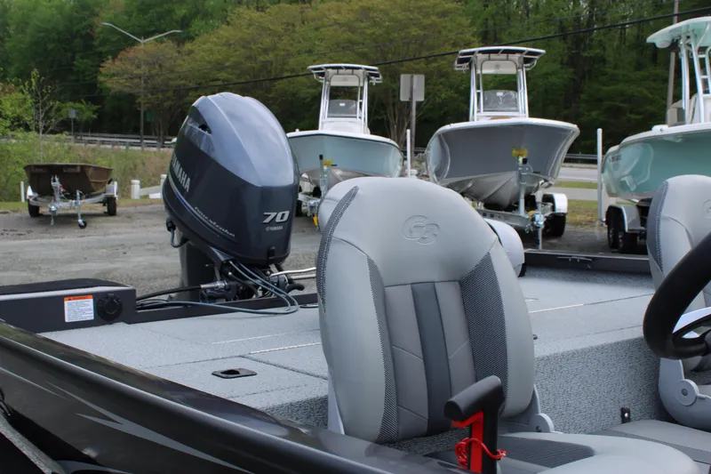 Slide: The Image of 2025 G3 Sportsman 1610 boat with Yamaha 70 engine, parked near other boats. - 14