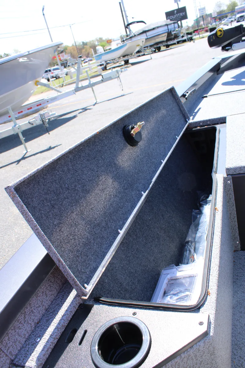 Slide: The Image of 2025 G3 Sportsman 1610 boat storage compartment open, showcasing interior space. - 15