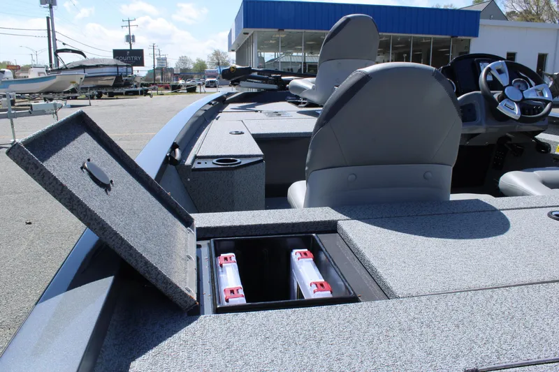 Slide: The Image of 2025 G3 Sportsman 1610 boat with open storage compartment and visible batteries. - 21