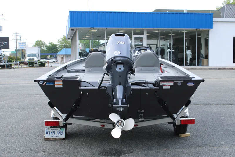 Slide: The Image of 2025 G3 Sportsman 1610 boat, rear view, parked outside dealership. - 4