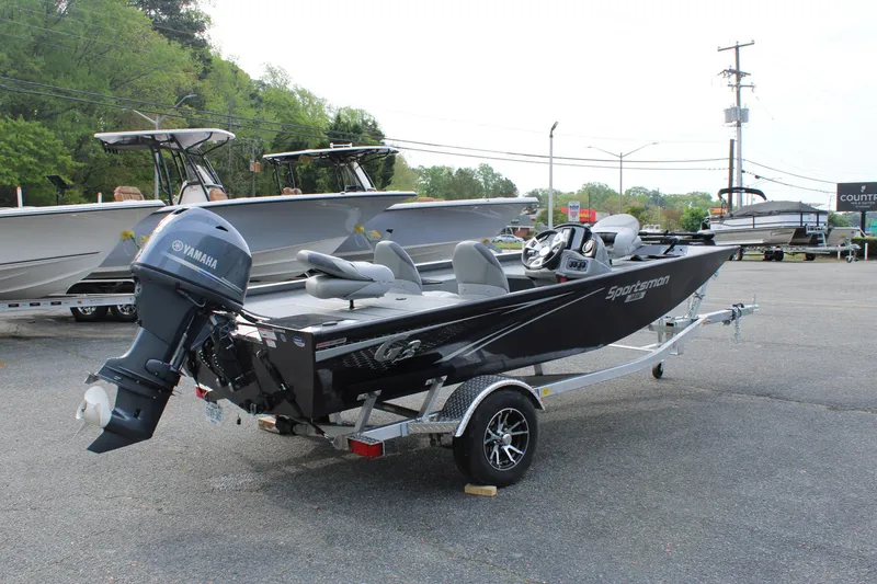 Slide: The Image of 2025 G3 Sportsman 1610 boat with Yamaha motor on trailer, parked outdoors. - 5