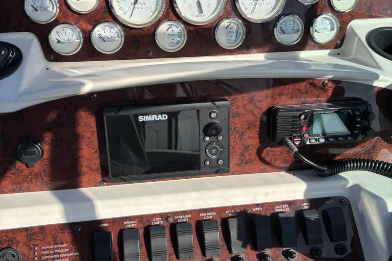 Slide: The Image of Control panel of a 1998 Wellcraft 3000 Martinique boat with gauges and electronics. - 15