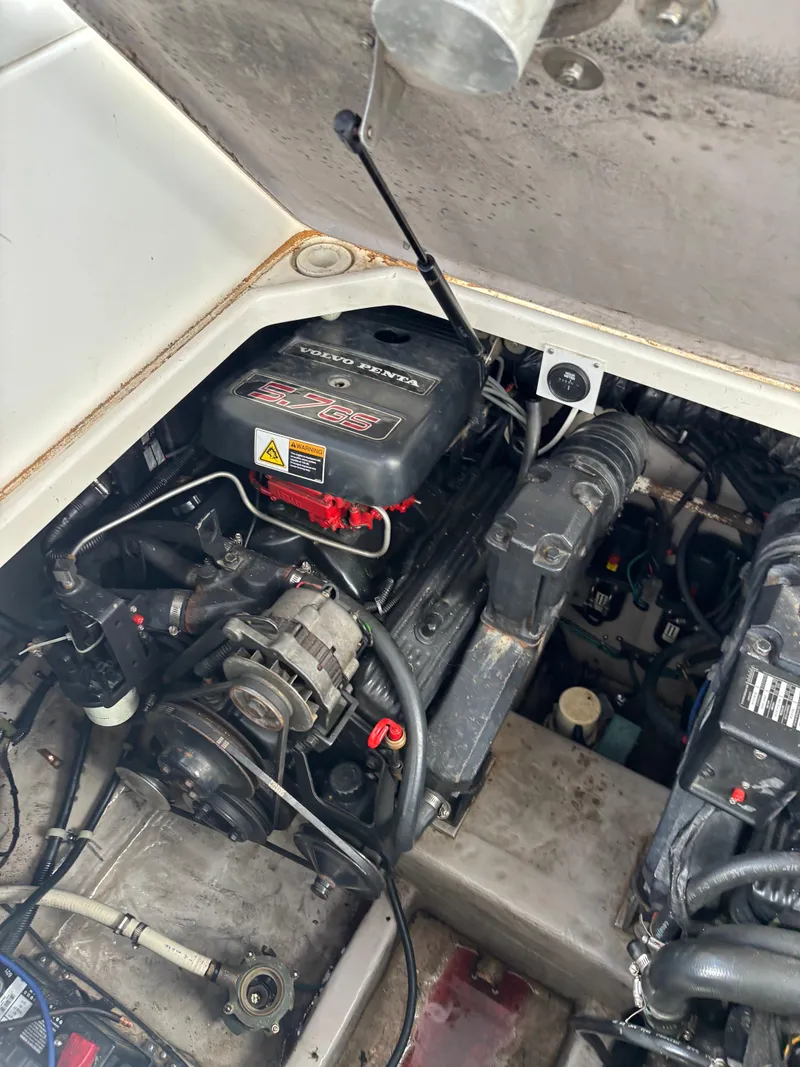 Slide: The Image of Engine compartment of a 1998 Wellcraft 3000 Martinique boat, showcasing mechanical components. - 17