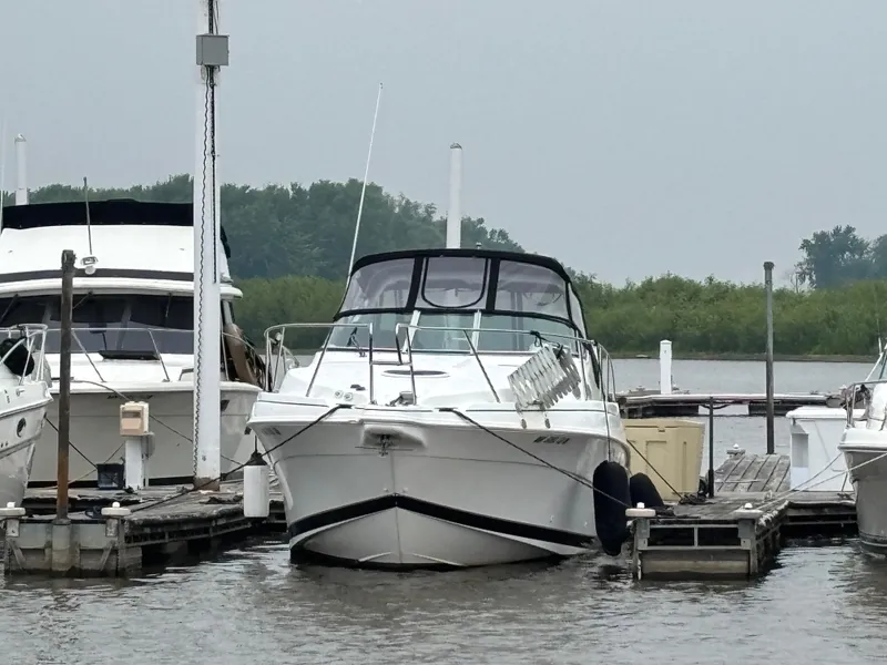 Slide: The Image of 1998 Wellcraft 3000 Martinique boat docked at a marina. - 21