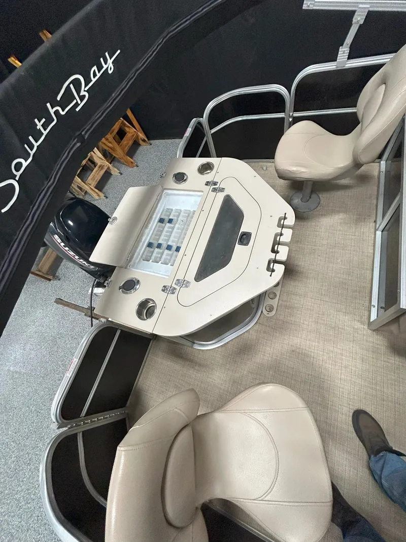 Slide: The Image of 2018 South Bay 220FCR boat interior with helm and seating. - 8