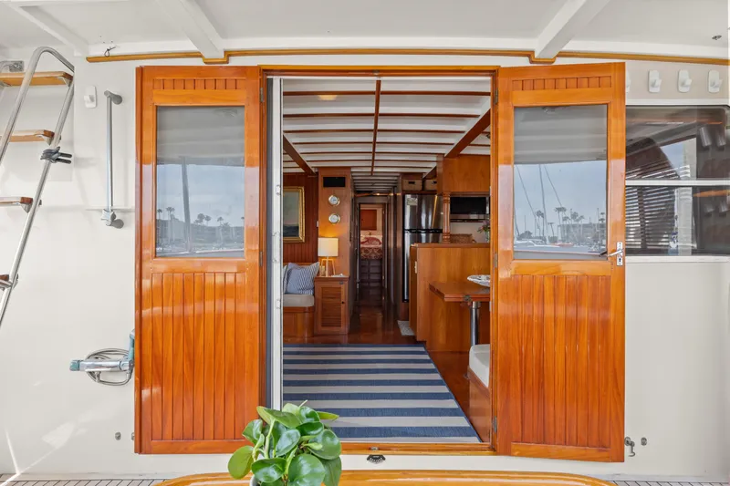 Slide: The Image of Interior view of 1996 Kadey-Krogen 48 Whaleback yacht with wooden doors and striped rug. - 11