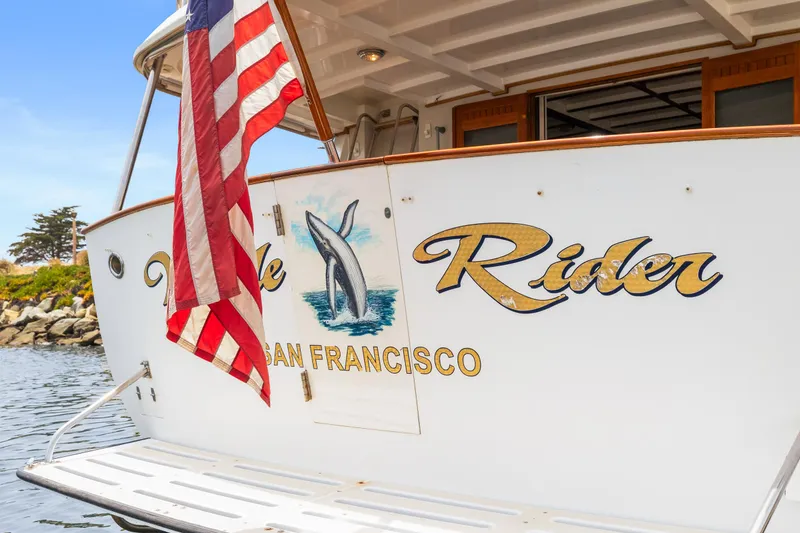 Slide: The Image of 1996 Kadey-Krogen 48 Whaleback yacht with American flag, San Francisco. - 2
