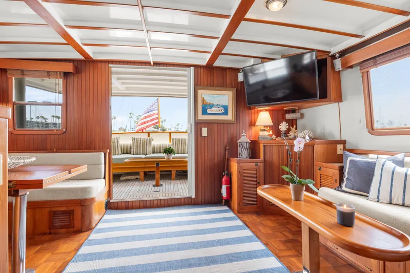 Slide: The Image of Interior of 1996 Kadey-Krogen 48 Whaleback yacht with cozy seating and nautical decor. - 25