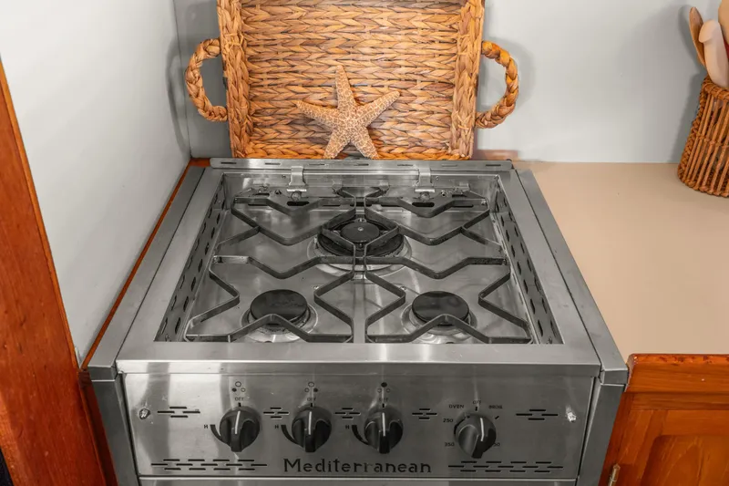 Slide: The Image of Stainless steel stove in Kadey-Krogen 48 Whaleback yacht kitchen, 1996 model. - 32