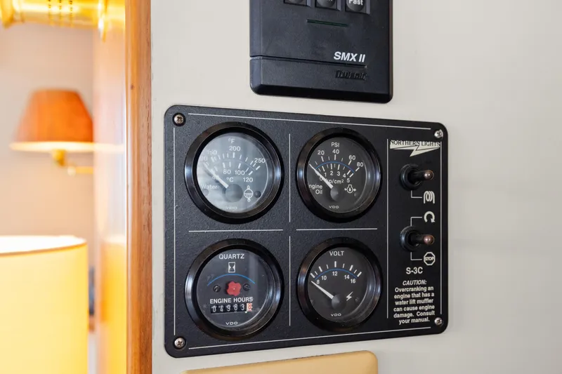 Slide: The Image of Control panel on 1996 Kadey-Krogen 48 Whaleback yacht with gauges and switches. - 38