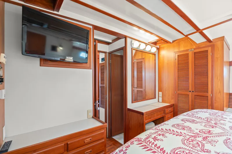 Slide: The Image of Luxurious 1996 Kadey-Krogen 48 Whaleback cabin with wood paneling and modern amenities. - 45