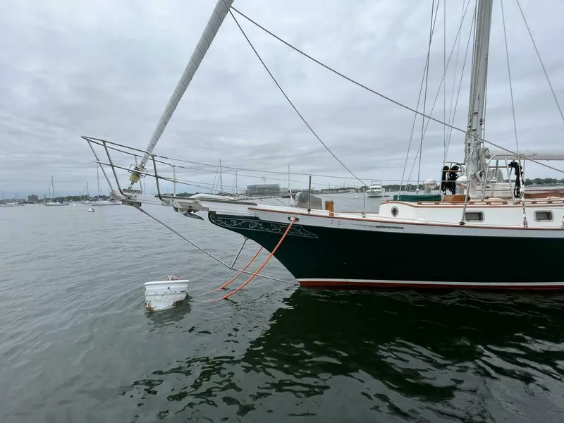 Slide: The Image of Cherubini 44 sailboat from 1979 docked on a cloudy day. - 1