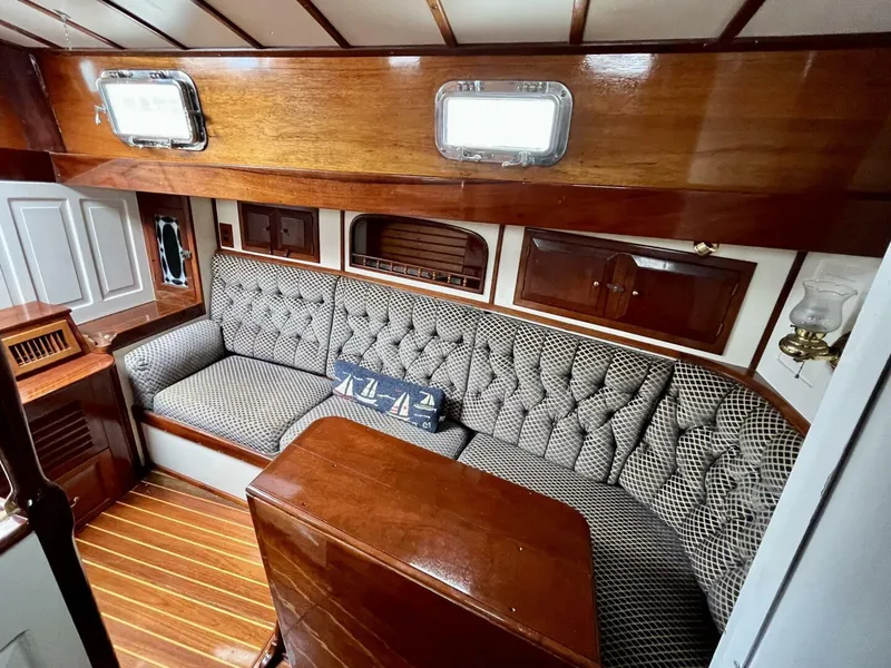 Slide: The Image of Luxurious 1979 Cherubini 44 yacht interior with elegant wood finish and plush seating. - 14
