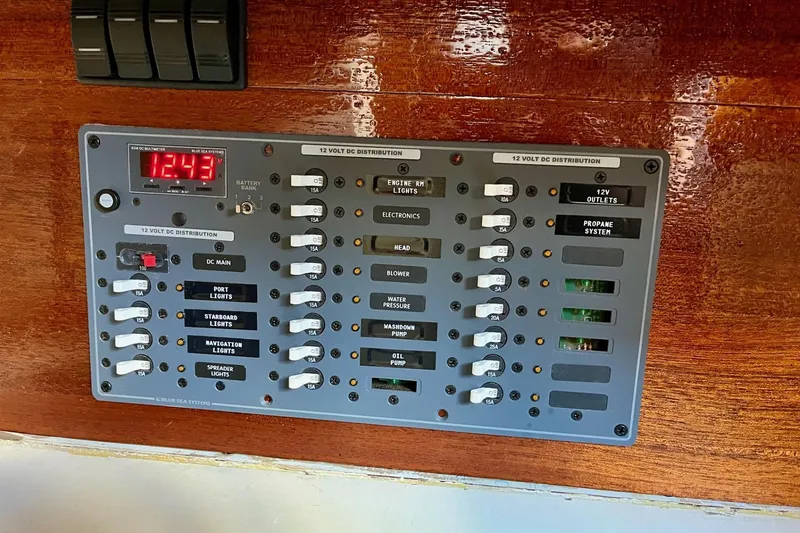 Slide: The Image of Electrical panel on a 1979 Cherubini 44 sailboat, featuring 12V DC distribution. - 24