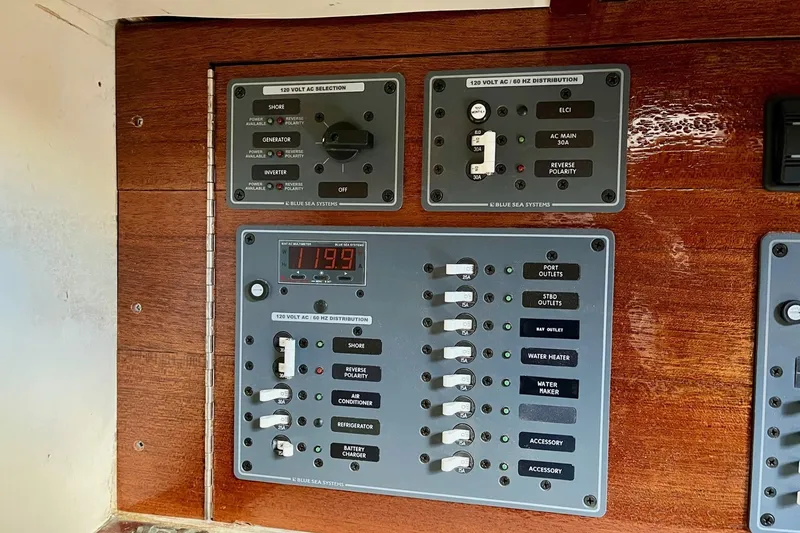 Slide: The Image of Electrical panel on 1979 Cherubini 44 boat, featuring Blue Sea Systems controls. - 25