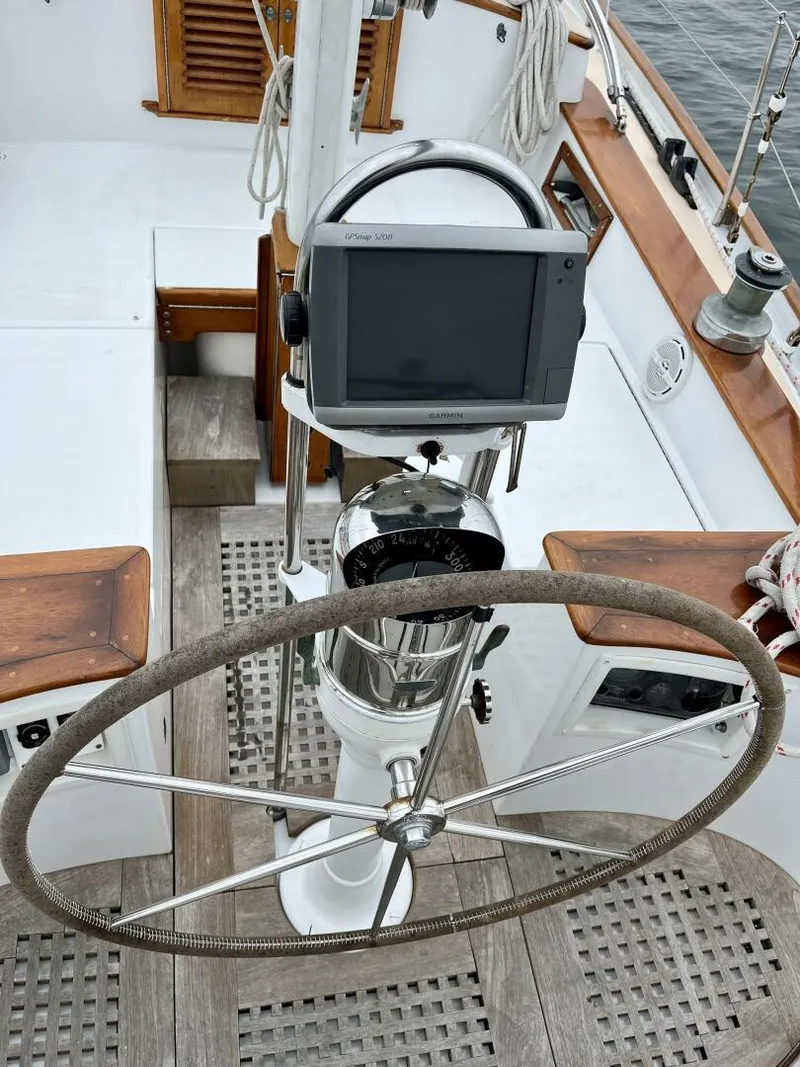Slide: The Image of Steering wheel of a 1979 Cherubini 44 sailboat with navigation equipment. - 3
