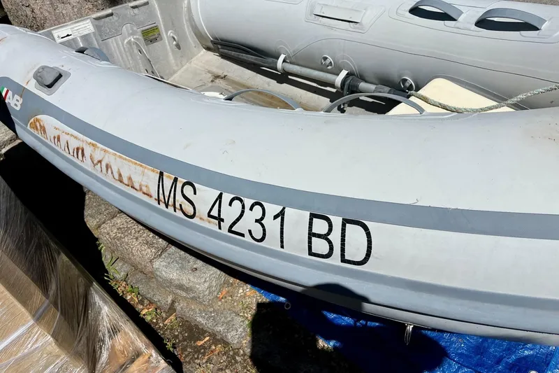 Slide: The Image of Inflatable boat with registration "MS 4231 BD" beside a Cherubini 44, 1979 model. - 33