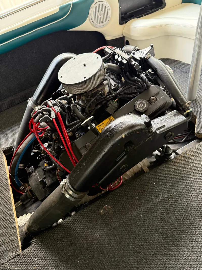 Slide: The Image of 1996 MasterCraft 205 PRO STAR engine with red wires and black components. - 11