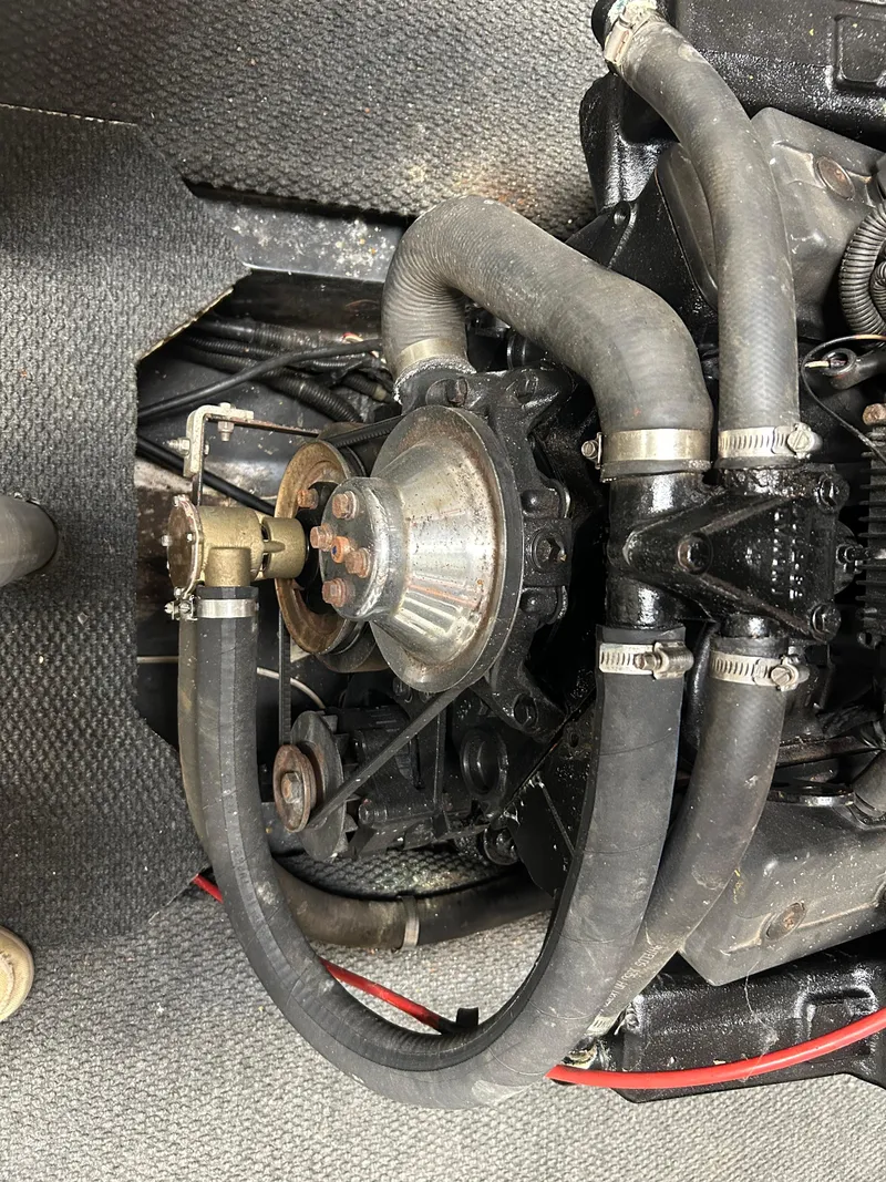 Slide: The Image of Close-up of a 1996 MasterCraft 205 PRO STAR engine with visible hoses and components. - 14