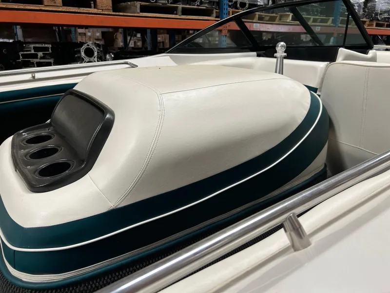 Slide: The Image of 1996 MasterCraft 205 PRO STAR boat interior with white and teal upholstery. - 5