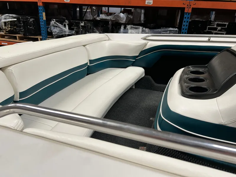 Slide: The Image of Interior of a 1996 MasterCraft 205 PRO STAR boat with white and teal seating. - 6