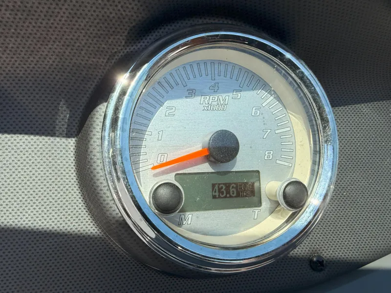 Slide: The Image of Close-up of a 2016 Yamaha SX190 boat tachometer displaying 43.6 hours. - 13