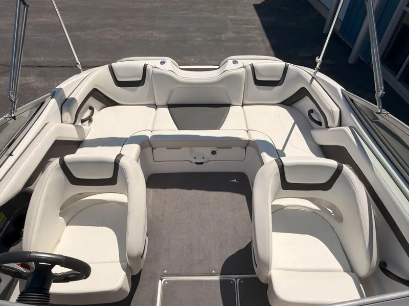 Slide: The Image of 2016 Yamaha Boats SX190 interior with white seating and steering wheel. - 18