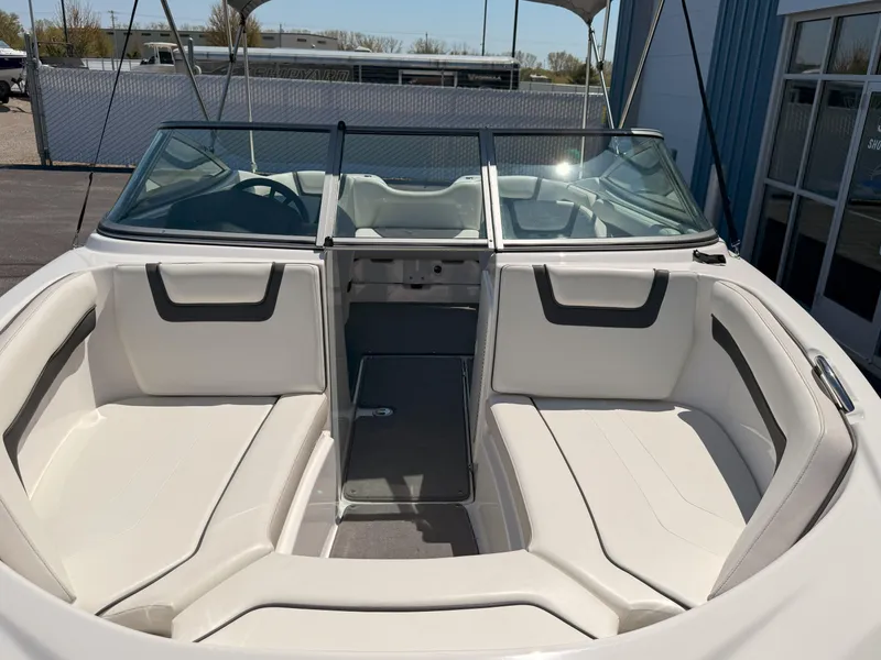 Slide: The Image of 2016 Yamaha Boats SX190 interior with spacious seating and windshield. - 22