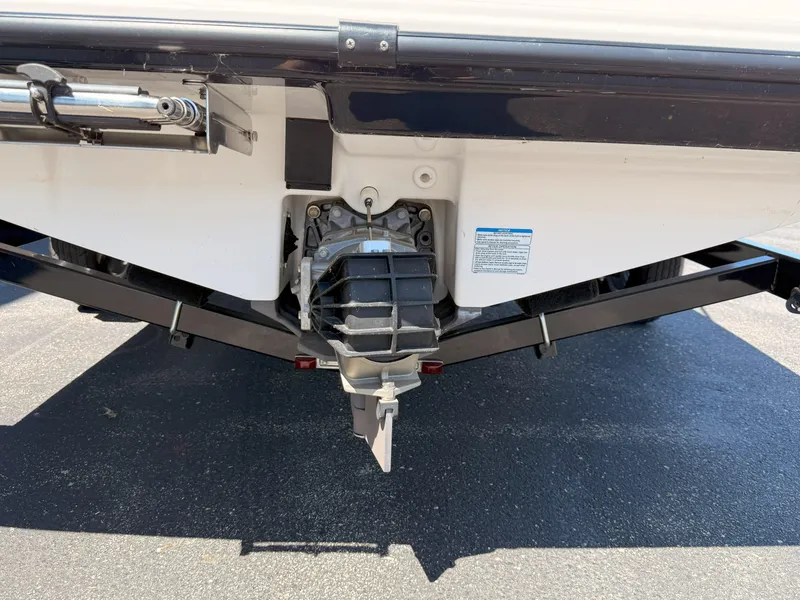 Slide: The Image of 2016 Yamaha Boats SX190 jet drive system, rear view on pavement. - 23
