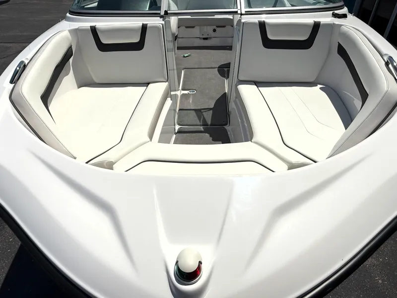 Slide: The Image of 2016 Yamaha Boats SX190 interior with white seating and open bow design. - 4